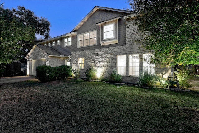 view of front of house featuring a garage and a front yard