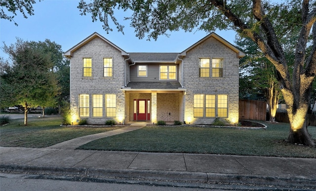 front facade with a front lawn