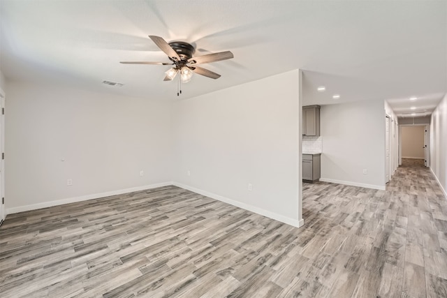 interior space with ceiling fan and light wood-type flooring