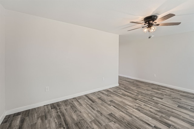 empty room featuring hardwood / wood-style flooring and ceiling fan