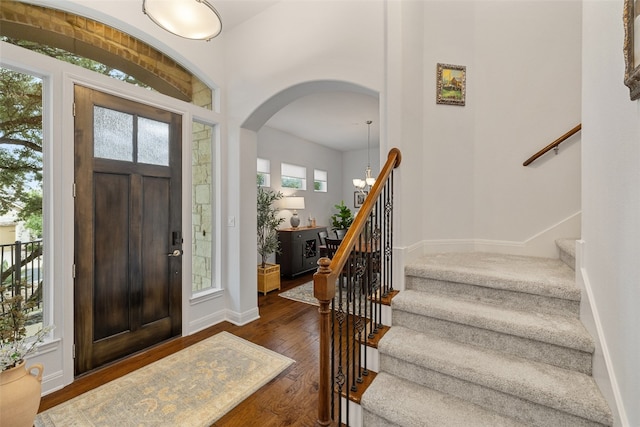 entryway with dark hardwood / wood-style flooring