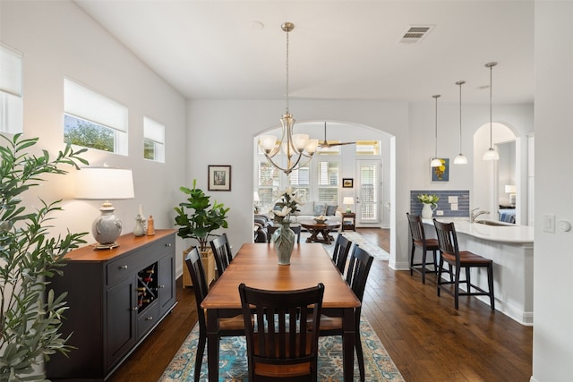 dining room featuring a chandelier and dark wood-type flooring