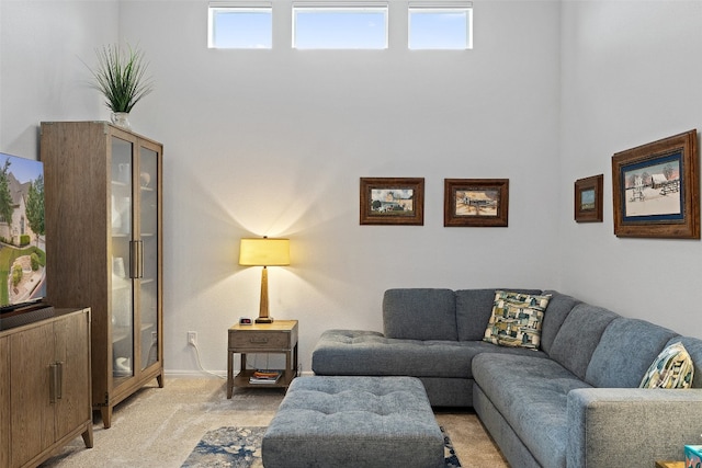 carpeted living room with a healthy amount of sunlight