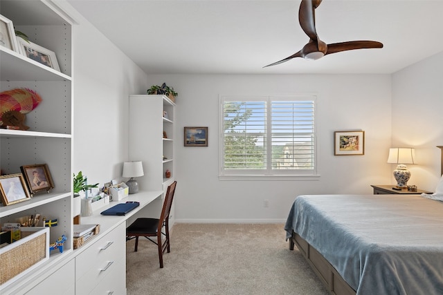 bedroom with ceiling fan and light colored carpet