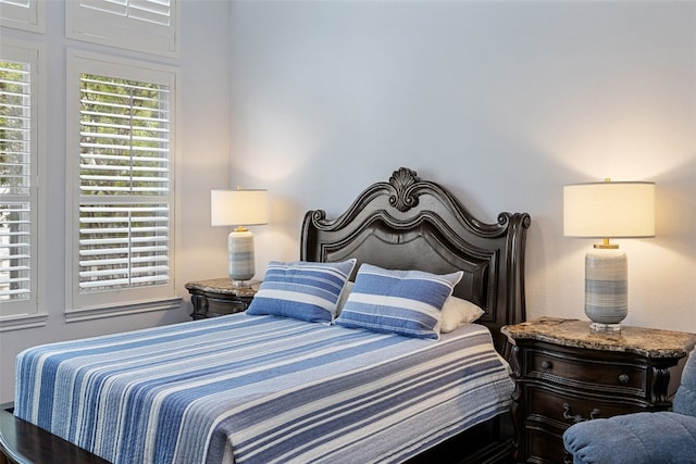 bedroom with hardwood / wood-style flooring