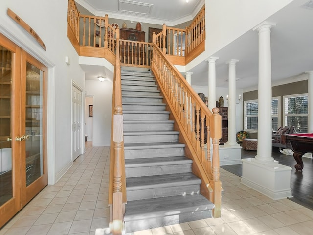 staircase featuring ornamental molding, pool table, tile patterned floors, and french doors