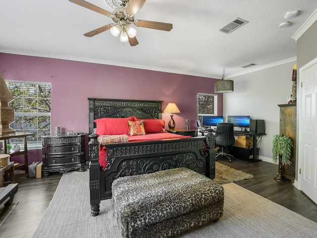 bedroom featuring ornamental molding, ceiling fan, dark hardwood / wood-style floors, and a textured ceiling