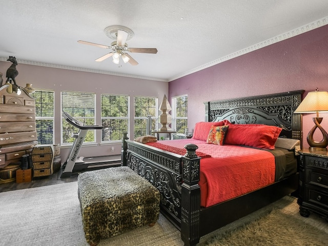 bedroom with crown molding, a textured ceiling, and ceiling fan