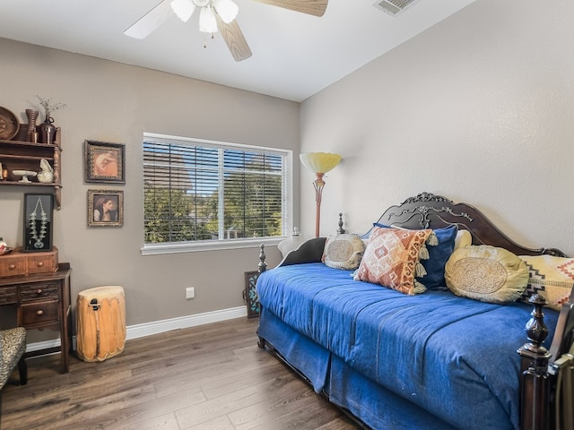 bedroom with ceiling fan and hardwood / wood-style floors