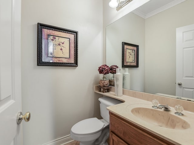 bathroom with crown molding, vanity, tile patterned flooring, and toilet