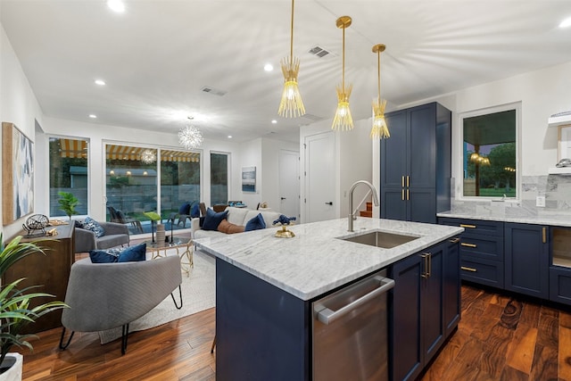 kitchen with an island with sink, stainless steel dishwasher, sink, and dark hardwood / wood-style flooring