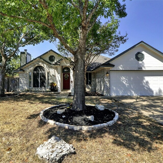 single story home featuring a garage