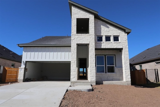 view of front of property with a garage