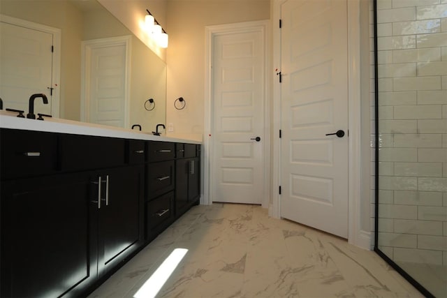 bathroom featuring double vanity and marble finish floor