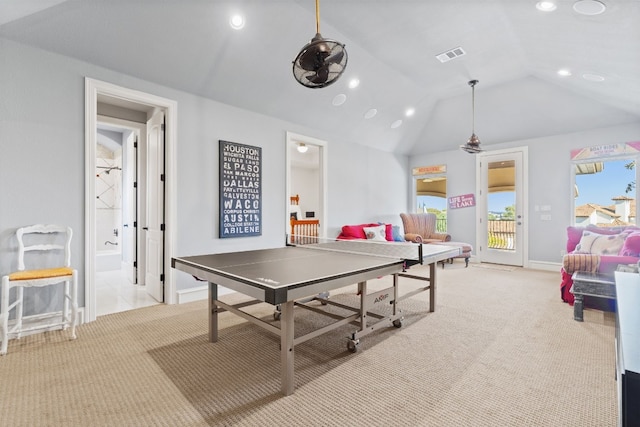 rec room with light colored carpet and lofted ceiling