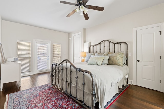 bedroom featuring dark hardwood / wood-style flooring and ceiling fan