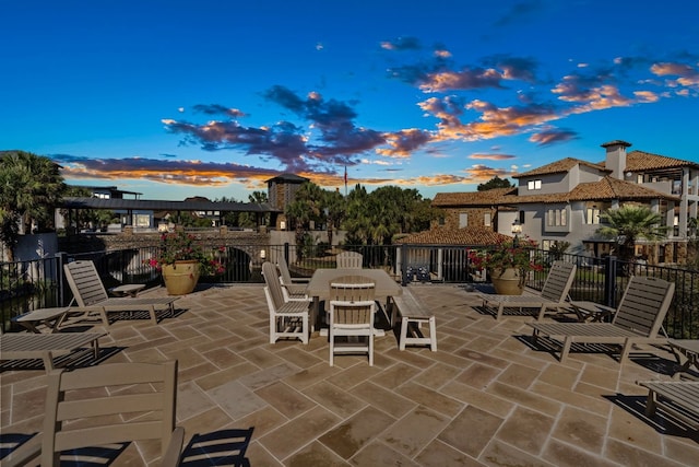 view of patio terrace at dusk