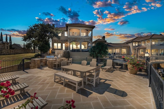 patio terrace at dusk with a balcony