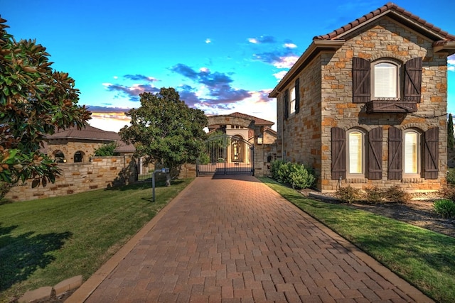 view of front of home with a lawn