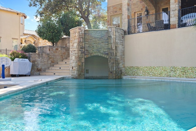 view of swimming pool with area for grilling