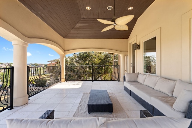 view of patio / terrace with ceiling fan and an outdoor living space