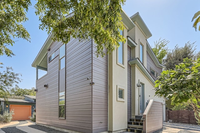 view of side of home featuring a garage