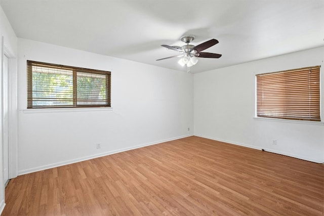 unfurnished room featuring hardwood / wood-style floors and ceiling fan