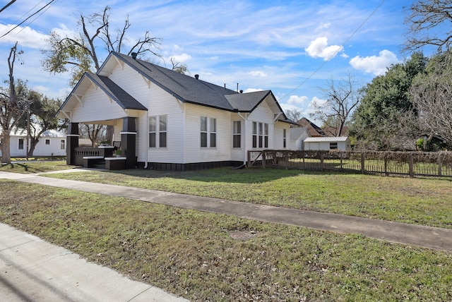 view of side of property featuring central air condition unit, a yard, and a porch