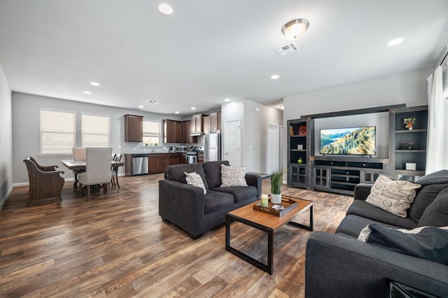 living room with dark hardwood / wood-style floors