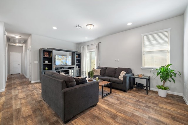 living room featuring dark wood-type flooring