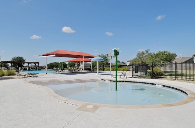 view of swimming pool with a patio