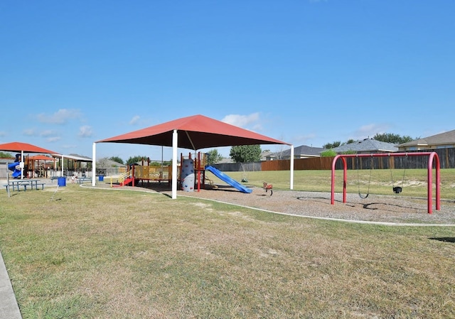 view of playground with a lawn