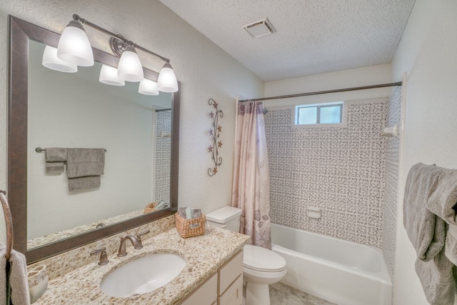 full bathroom featuring vanity, toilet, shower / bathtub combination with curtain, and a textured ceiling