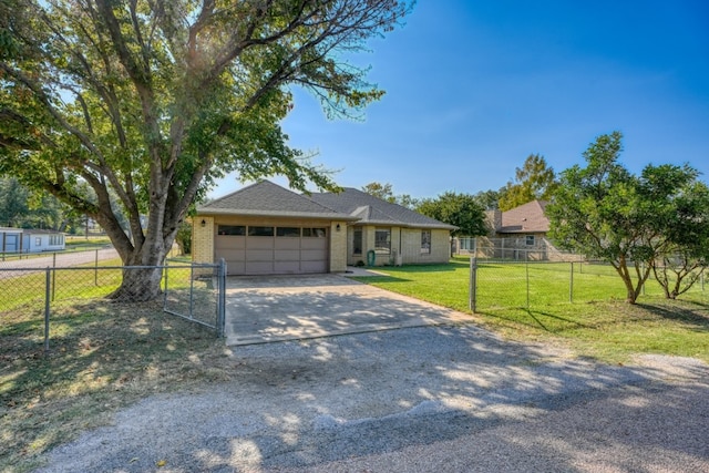 ranch-style home featuring a front yard and a garage