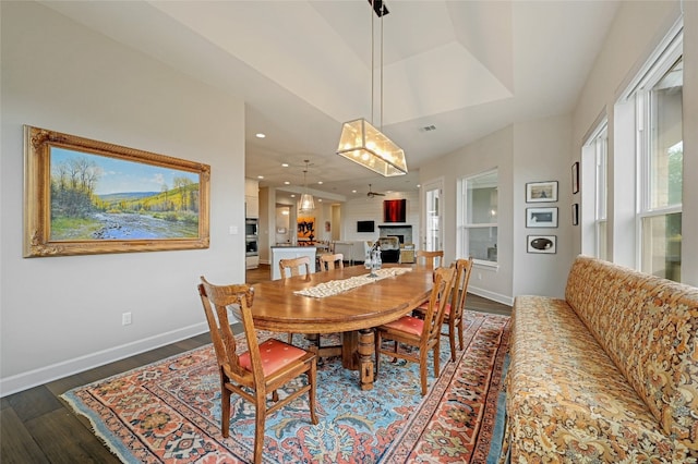 dining area with dark hardwood / wood-style floors