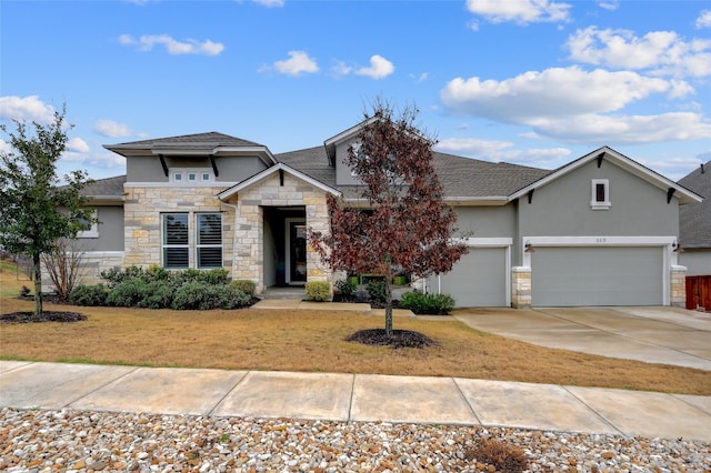 view of front of home featuring a garage and a front lawn