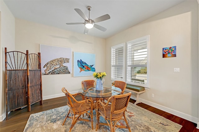 dining room featuring ceiling fan and dark hardwood / wood-style floors