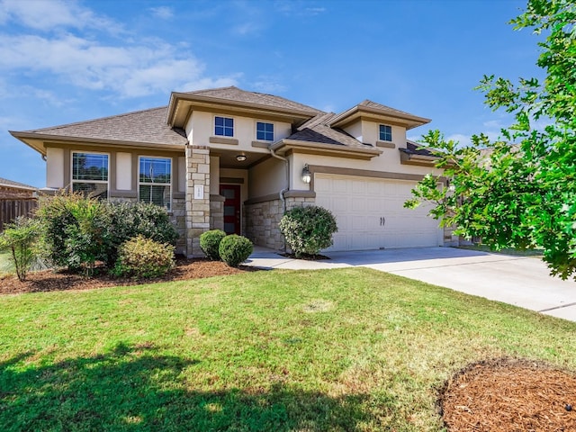 prairie-style home with a front lawn and a garage