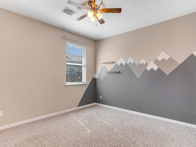 spare room with carpet flooring and ceiling fan