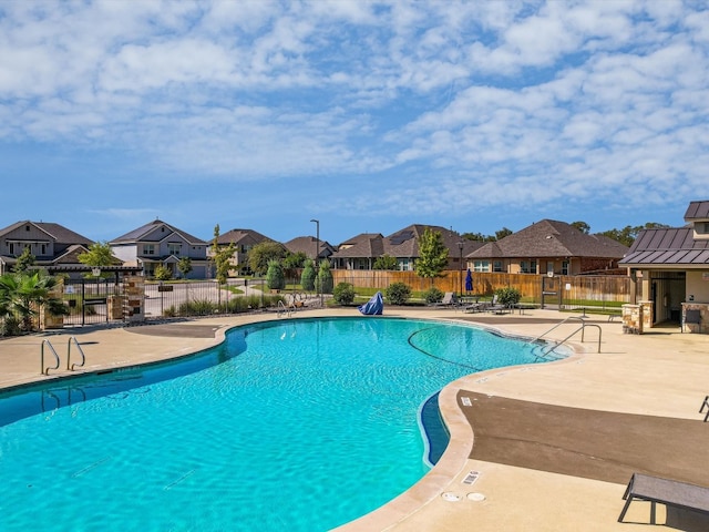 view of swimming pool featuring a patio