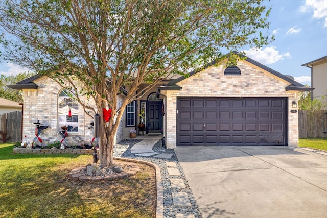 single story home with a garage and a front lawn