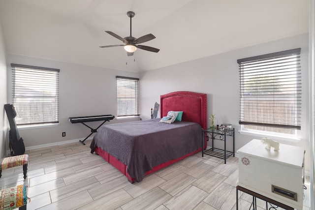 bedroom featuring ceiling fan and vaulted ceiling