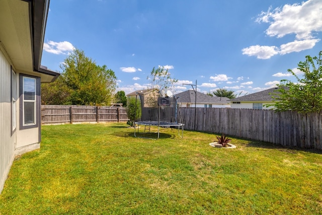 view of yard featuring a trampoline