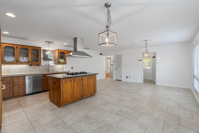 kitchen featuring tasteful backsplash, sink, extractor fan, hanging light fixtures, and dishwasher