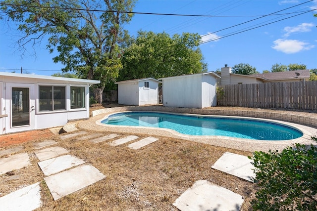 view of pool with a storage unit