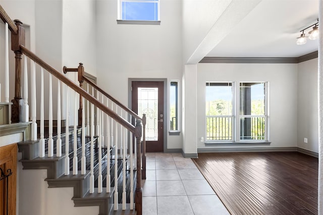 foyer entrance featuring ornamental molding and light hardwood / wood-style floors