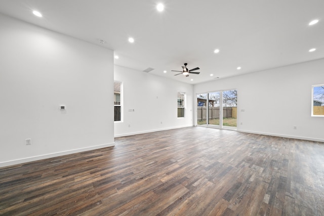 unfurnished living room featuring dark hardwood / wood-style floors and ceiling fan