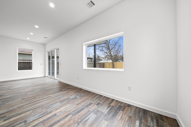 unfurnished room with dark hardwood / wood-style floors