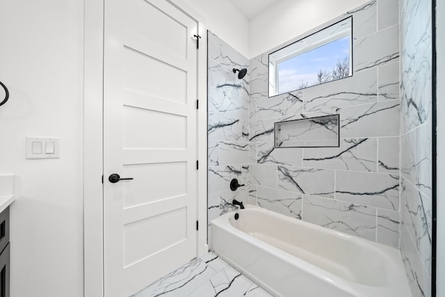 bathroom featuring vanity and tiled shower / bath combo