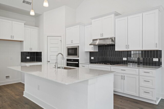 kitchen with white cabinets, black appliances, sink, and a kitchen island with sink